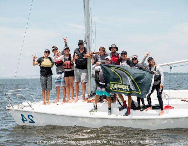 JU Sailing team on a regatta boat.